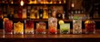 © Ol - The cocktails lined up on a wooden bar with warm bokeh lights