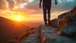 © Viktor - Person walks up stone steps on mountain summit during vibrant sunset. Scene represents personal growth, career advancement, achieving life goals with feeling of accomplishment, joy. Focus on