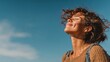 © Johannes - woman smiling looking up to blue sky taking deep breath celebrating freedom positive human emotion face expression feeling life perception success peace mind concept free happy girl enjoying nature n