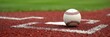 © Sasira - Close-up shot of a baseball resting on home plate, surrounded by chalked lines, ready for the next at-bat The image evokes the excitement and anticipation of a baseball game , America, play