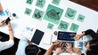 © InfiniteFlow - A top view capture of a business meeting focusing on environmental sustainability, featuring charts, graphs, and eco-friendly icons to promote discussion and strategy. Raster
