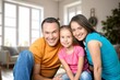 © BillionPhotos.com - Cheerful smiling family sitting in the living room