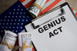 © syahrir - Concept of genius act with the United States flag write on clipboard isolated on Wooden Table.