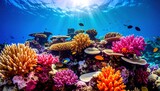 Vibrant coral reef teeming with colorful fish in a sunlit underwater scene.