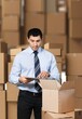 © BillionPhotos.com - Worker with cardboard box, delivery concept