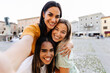 © Xavier Lorenzo - Three multiracial young women taking selfie portrait during summer vacation. Fermale friendship concept with small group of girls having fun together outside