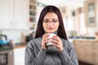 © BillionPhotos.com - Woman relaxing drinking tea sitting at home