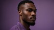 © Alteisen Riese - Handsome African man in plain purple background, side view looking on the right
