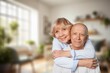 © BillionPhotos.com - Senior happy couple hugging in home together,