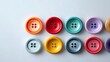 © kirania - A vibrant array of colorful buttons arranged in a symmetrical pattern against a light background.