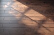 © Andiahmad - Sunlight streams across a brown wooden-look tile floor