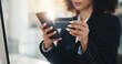 © peopleimages.com - Hands, credit card and business woman with phone for ecommerce, corporate purchase or online shopping. Debit, payment and female person for professional expense, internet banking or fintech app flare