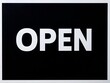 © Hi_depari - Bold white 'OPEN' text on a stark black background invites customers into your business.