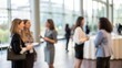 © N7 - Female professionals attending a corporate seminar — networking in a contemporary conference room