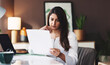 © peopleimages.com - Thinking, woman and reading document at house for planning, customer service and script. Agent, remote work and billing paperwork for problem solving, account information and procedure manual for crm
