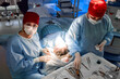 © Georgii - Medical professionals perform surgery in sterile operating room setting
