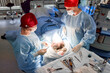 © Georgii - Medical team performing surgery in a sterile operating room