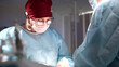 © Georgii - Surgeon performing focused procedures under sterile conditions in an operating room