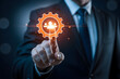 © KHYRUL - Businessman touching glowing gear with people icons representing teamwork and connection