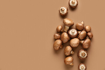 Wall Mural - Fresh raw mushrooms on brown background