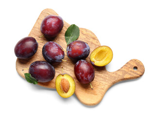 Wall Mural - wooden board with fresh ripe plums on white background