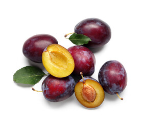 Wall Mural - Fresh ripe plums with leaves on white background