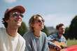 © SolaruS - Happy friends enjoying sunny day with music. Carefree lifestyle, positive vibes, summer, and togetherness. For travel, youth, friendship content.