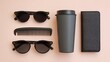 © Suka - Flat lay of black accessories on a pastel background