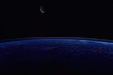 Wall Mural - an orbital view reveals a twilight horizon with a bluish tint.