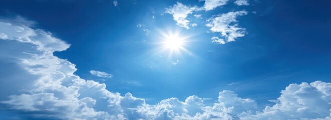 Wall Mural - Vast expanse of bright blue sky featuring fluffy white cumulus clouds and the dazzling light of the sun creating a serene, airy ambiance