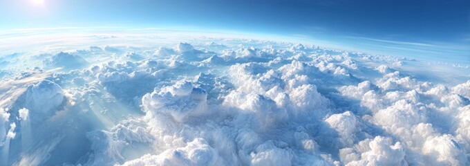Wall Mural - Panoramic view from above the clouds, showing the Earth's curvature, sunshine, and layers of the atmosphere, blue sky above