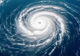 青い海に渦巻く巨大ハリケーンの衛星写真