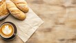 © afridwi - Bread latte and parchment paper on wooden table