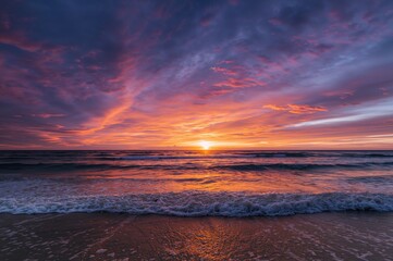Wall Mural - sunset over the ocean with vibrant sky hues