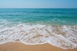Stunning shoreline featuring soft sand and calm turquoise waters in the distance.
