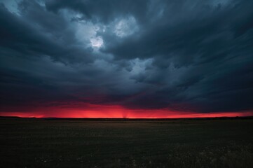 Wall Mural - sunset scenery with somber, dark clouds and crimson twilight panorama