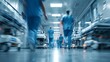 © Adi - Urgent Medical Care Concept with Blurred Movement of Healthcare Workers in Hospital