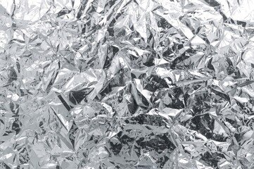Wall Mural - Crinkled aluminum foil with blurred texture, metallic surface background, silver distressed design, patterned material, shiny chrome-like sheet, grey tone, space for text, out of focus