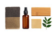 © puri - Natural cleaning supplies, a dark-colored cloth, spray bottle,  wooden block, and bar soap with leaves