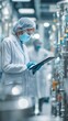 © Adi - Modern Sterile Manufacturing Process with Technician Using Tablet for Quality Control