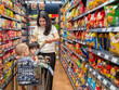 © Apichat - woman is shopping with two children in a grocery store