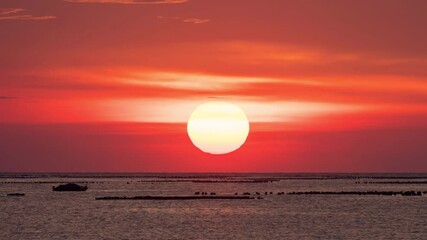 Wall Mural - Dramatic sunrise time lapse at the ocean  in a morning.