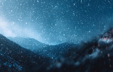 snowy mountain view dark blue mountains are blanketed in snow, with a bright light shining from the 