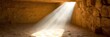 © Hakimul Islam Sorol - Sunbeams illuminating a sandy cave interior with rough stone walls and floor light