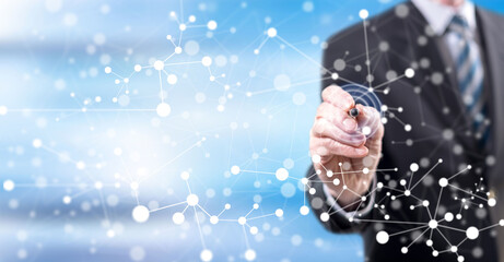 Wall Mural - Man touching a virtual network