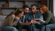 © Yuliia - Four multiracial friends at home party with mobile phone amazed shocked wonder casino betting waiting result watching online sport game cyberspace broadcasts internet victory diversity people emotions