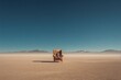 © Kanurism - Person sitting in chair desert landscape blue sky