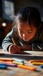 © akridiy - Underprivileged girl drawing with crayons in sunlight