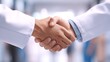 © ali - A sincere handshake between doctors symbolizing collaboration trust and a unified approach to healthcare with clean