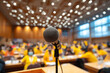 © vidi - Microphone on Stage with Audience in Conference Hall for Effective Speech